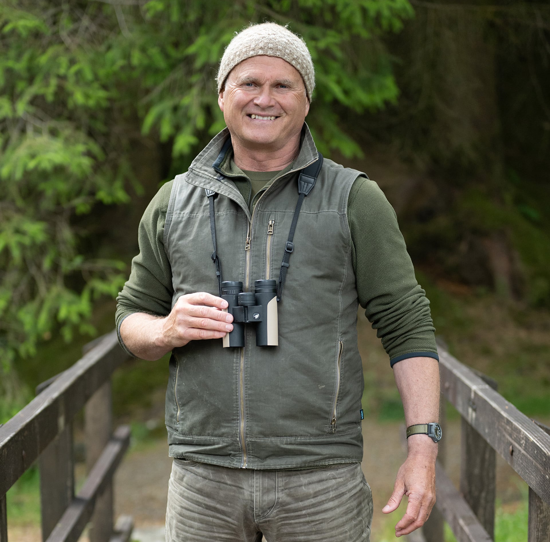 Simon King, binoculars around his neck, nature